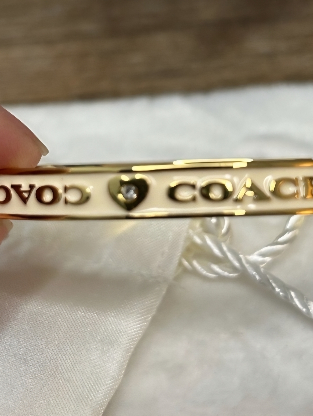 Coach Gold-Tone Bracelet with Cream Enamel and Heart Accent